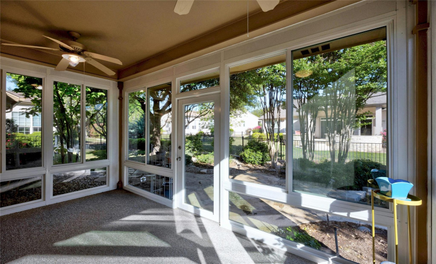Enjoy the outdoors from within the comforts of your covered and glassed back patio!