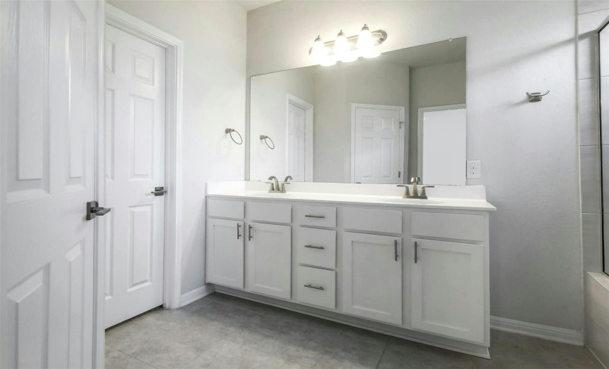 Ensuite bath has a private commode and walk-in closet