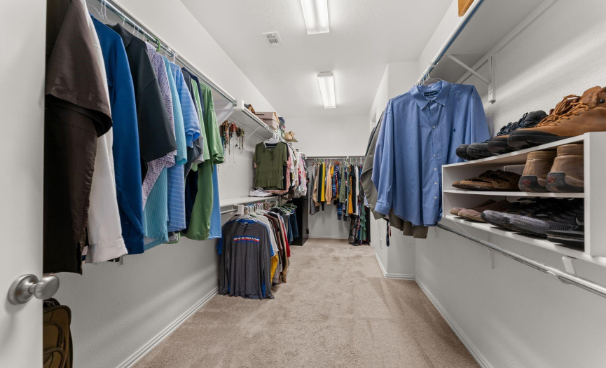 Large primary closet which is adjacent to the laundry room.