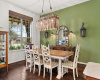 Charming dining room with designer lighting and big picture window.