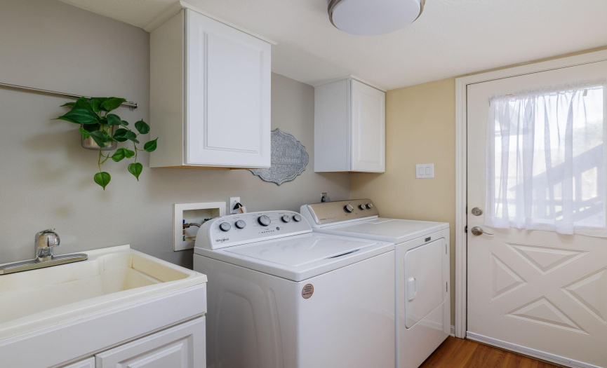Nice size laundry room with sink.