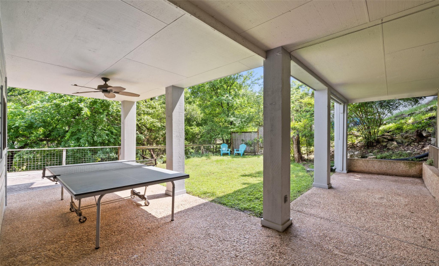 The lower-level covered patio area has endless possibilities.  There is also a usable flat backyard.