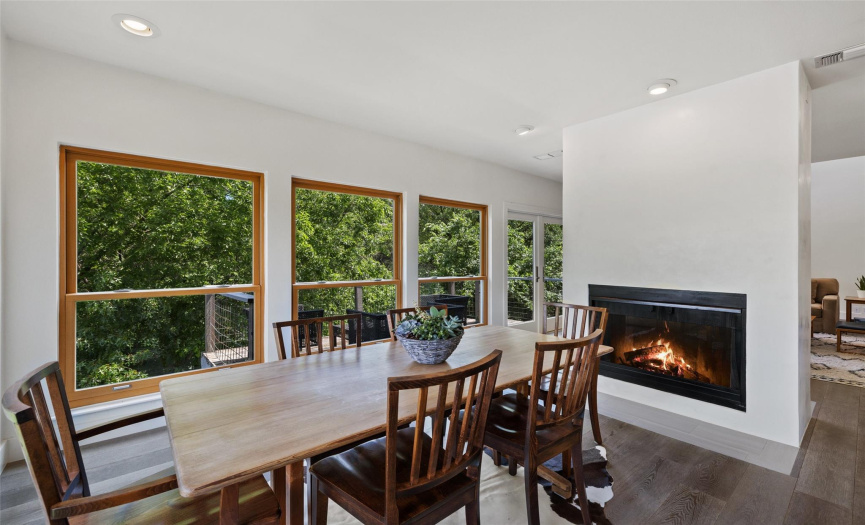 This additional dining room has beautiful views and a two-sided fireplace.