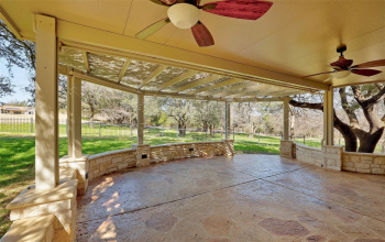 Come enjoy this incredible covered patio, a versatile outdoor space perfect for al fresco dining, entertaining guests, or simply relaxing in the shade right on the Legacy Golf Course in Sun City Texas. 