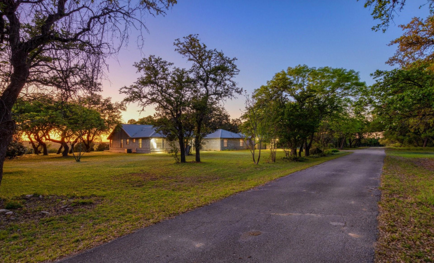 Long asphalt driveway leads you from Liberty Hills Lane to the home. 