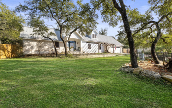 Beautiful stone home set in a treed quiet cul-de-sac in Woodcreek on .78 of an acre per HCAD
