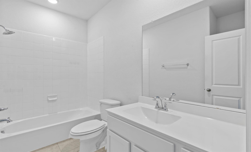 Guest bathroom offers warm and relaxing colors and a spa-like experience. 