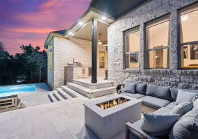 Outdoor entertaining is a breeze with a built-in outdoor kitchen, pool and fire pit areas.