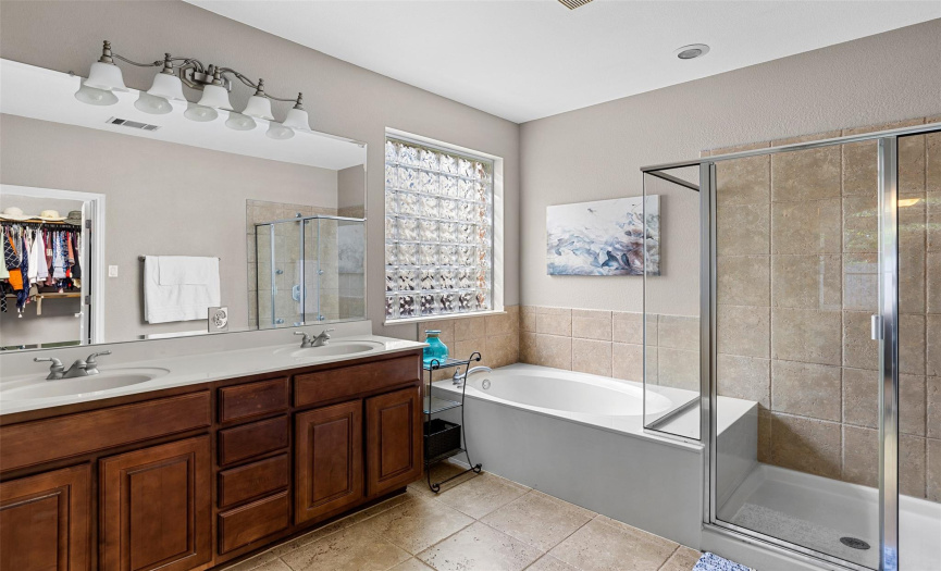 Over-sized shower, custom cabinets.