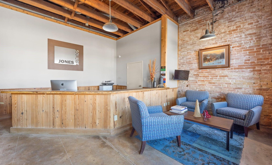 This is the adjoining space included in this sale. Concrete floors, exposed brick walls and rafters, make for a stylish and sophisticated interior.