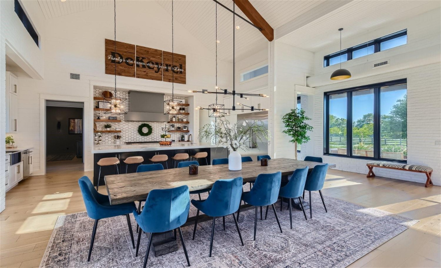 An entertainer's dream: the dining space, nestled between the gourmet kitchen and living room, offers seamless hosting in a welcoming ambiance.