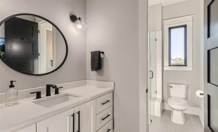 Conveniently situated between two bedrooms, the Jack and Jill bathroom offers practicality and ease for seamless shared living.