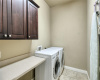 laundry room, large space, folding table, cabinet storage