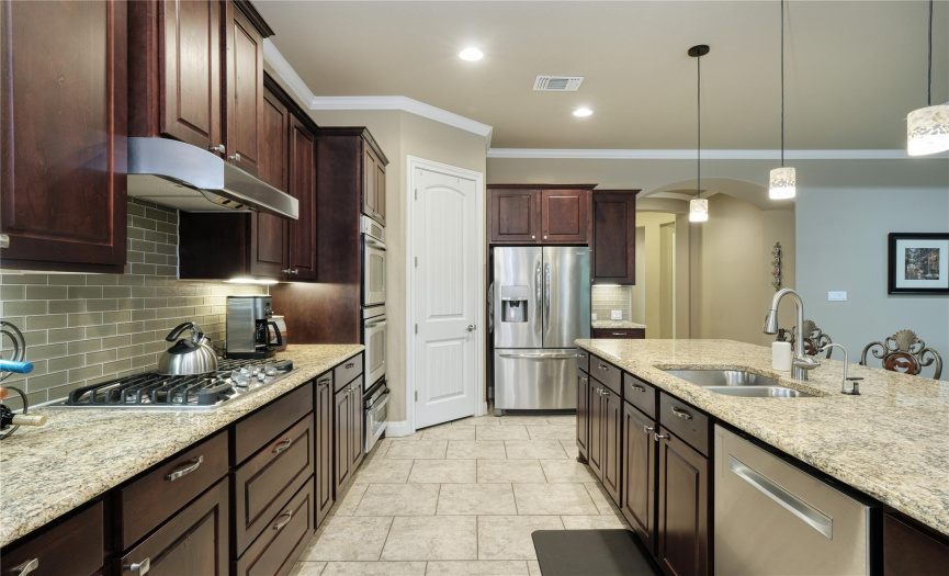 Kitchen, granite counter tops, large island, double oven, recessed lighting