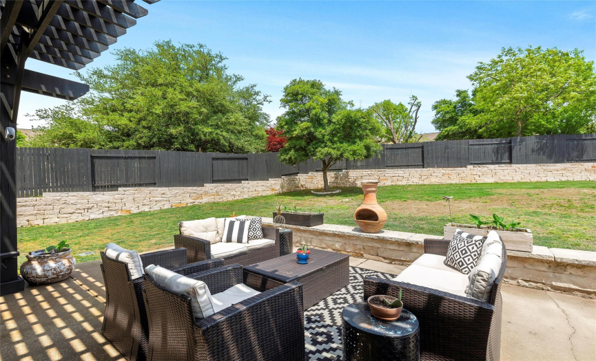 Large backyard with retaining wall adding to privacy.