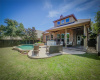 Large backyard features pool and outdoor grill. Perfect for entertaining.
