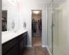 The primary bath features a large walk-in shower and sizable closet for fantastic storage.