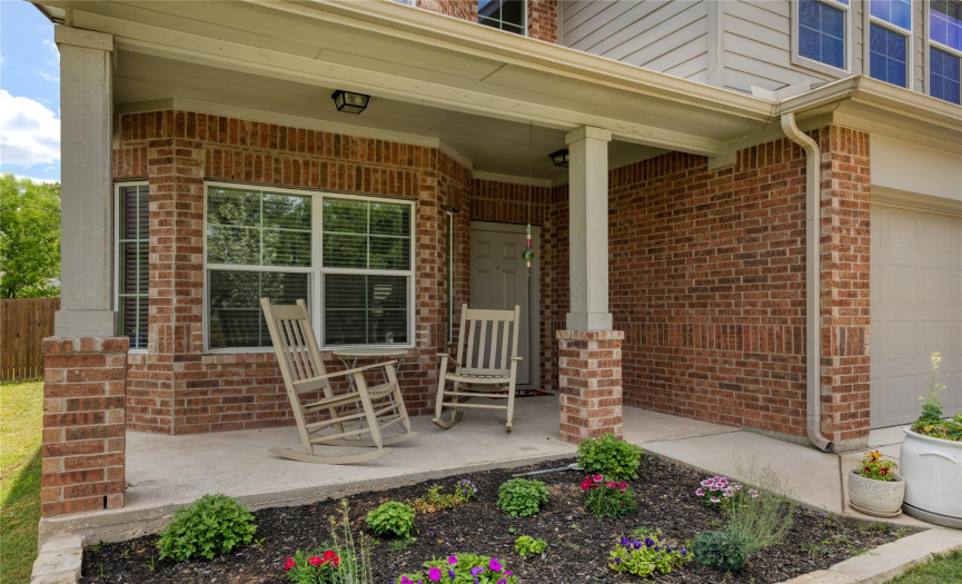 The covered front porch invites you and your guests into this lovely home.