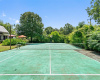 The property includes a full tennis court, the perfect place for staying active!