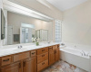 Primary bath has dual sinks and lots of cabinet space along with a soaker tub! 