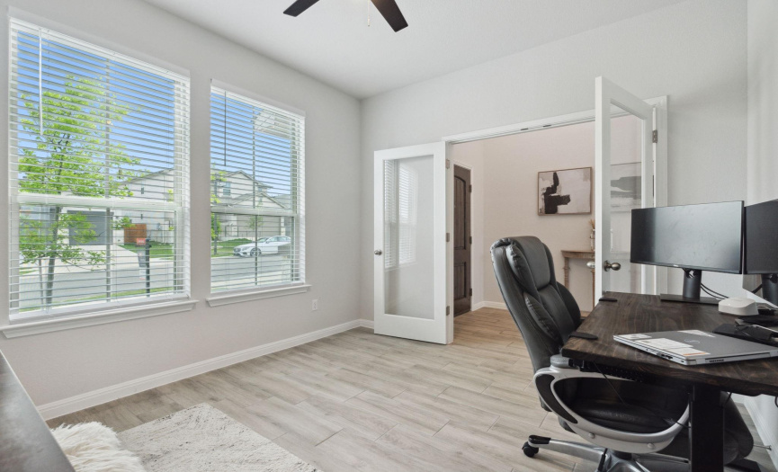 Immediately to the right, an office space is thoughtfully positioned, offering privacy and convenience for the remote worker.