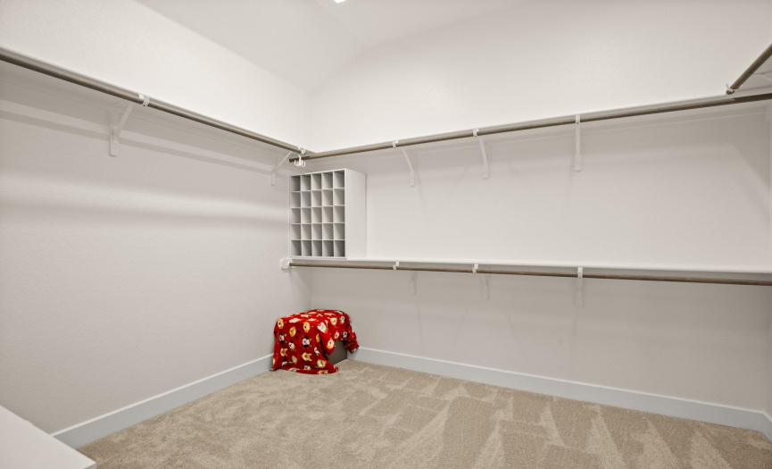 Organize your wardrobe effortlessly in the walk-in closet, equipped with auto lights for added convenience.
