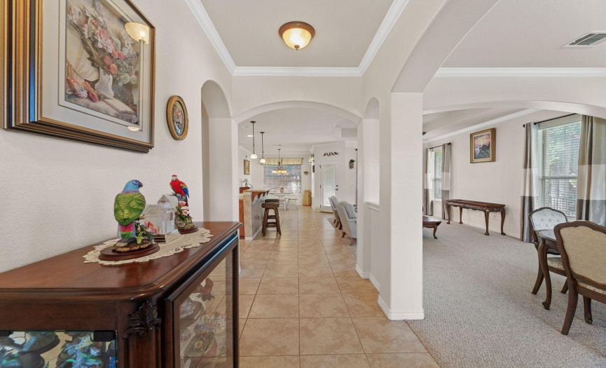 Elegant Entry - Notice the high ceilings, curved archways and crown molding