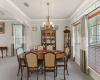 Formal Dining Room - Notice the chandelier, high ceiling, crown molding, blinds & drapes