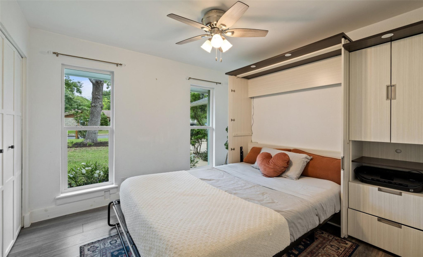 Secondary bedroom #1 features a murphy bed with storage - perfect guest room/office set up!