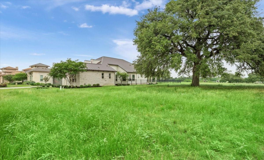 Lot to east side with beautiful Heritage Oak tree is available for purchase and developer will allow replatting allowing for one HOA and Membership fee. Fence could be extended. Perfect for Guest Casita or Pool.