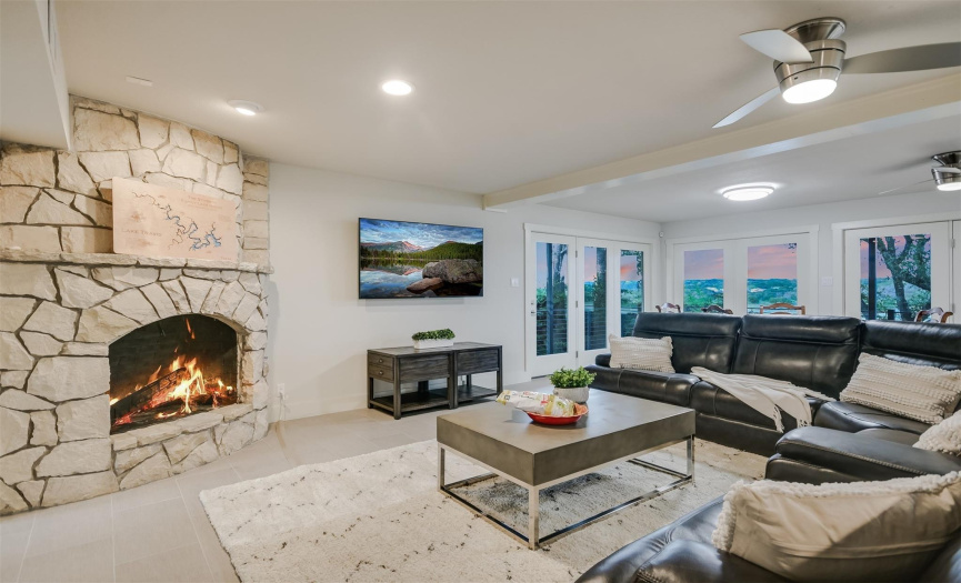 The secondary living room, with its own fireplace, offers a cozy space for family movie nights or quiet relaxation
