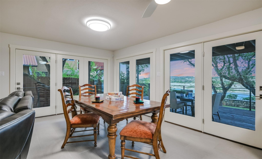 The secondary living room dining area offers direct access to the back patio