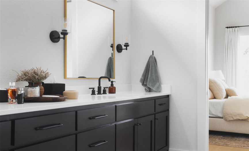 The spa-like ensuite bath boasts a luxurious dual vanity, providing ample space for morning routines and pampering sessions