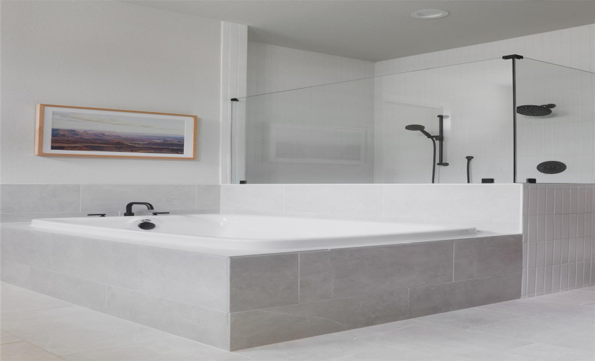 Relax and unwind in the deep soaking tub or rejuvenate with a refreshing shower in the spacious walk-in shower, creating a serene oasis for ultimate comfort and indulgence