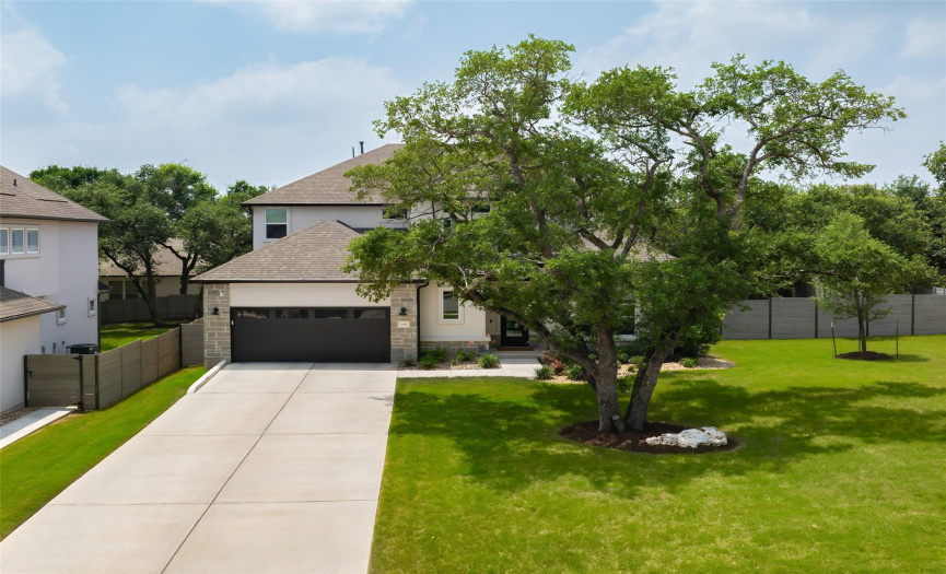 Mature oak trees in the front yard offer shade and a welcoming ambiance from the moment you pull into the driveway