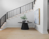 A curved staircase sits off of the front entry, offering a welcoming ambiance