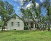 Great drive-up appeal with mature, healthy oaks framing this limestone beauty.