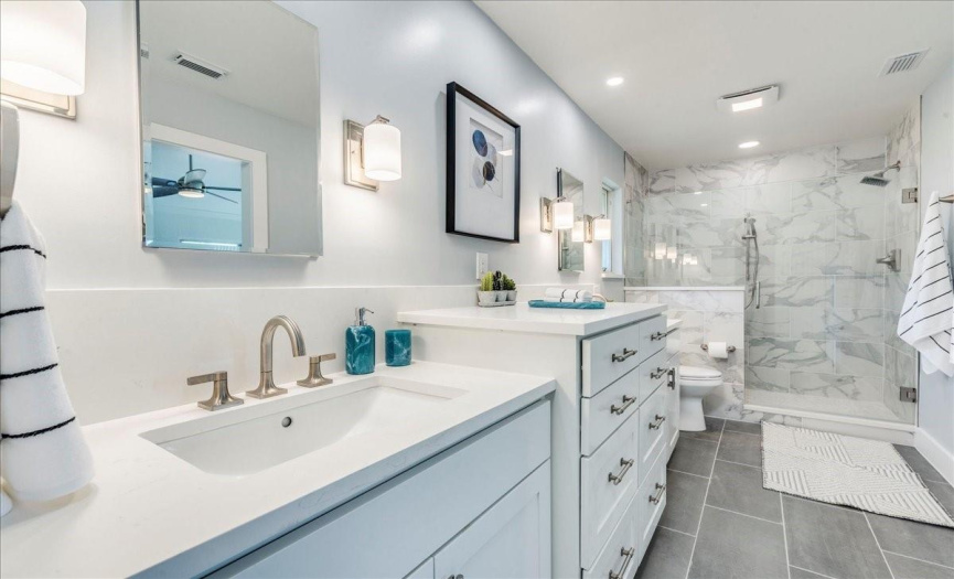 this new master bath has a spa feel and a light color palette