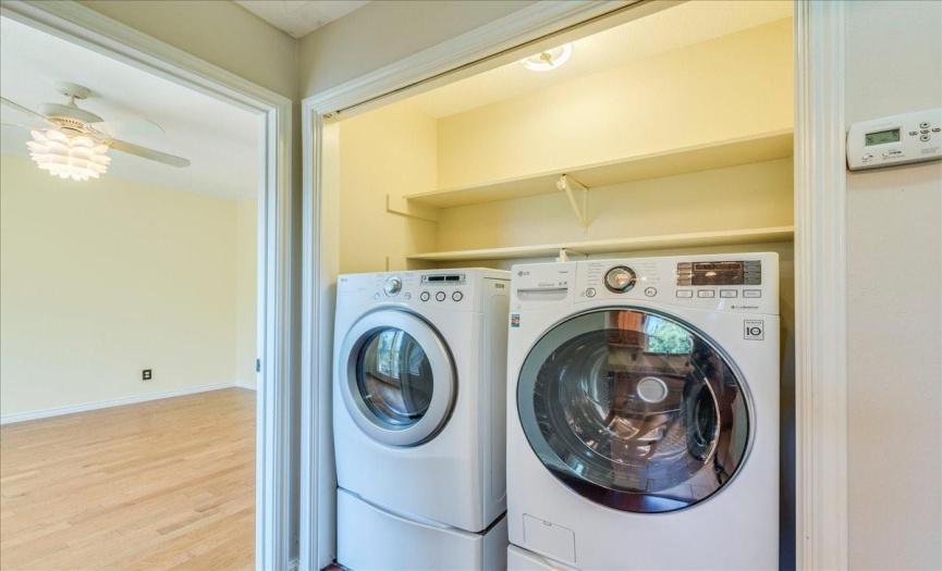 Full-size washer and dryer convey with the condo. . With pull-down attic stairs providing easy access to additional storage space, this home offers unmatched convenience. Don't miss your chance to experience the unparalleled beauty of Valleyside Place. 