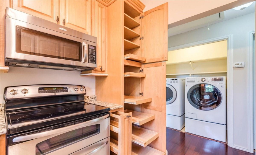 High end cabinetry with pull-out pantry, spice rack and recycling center!