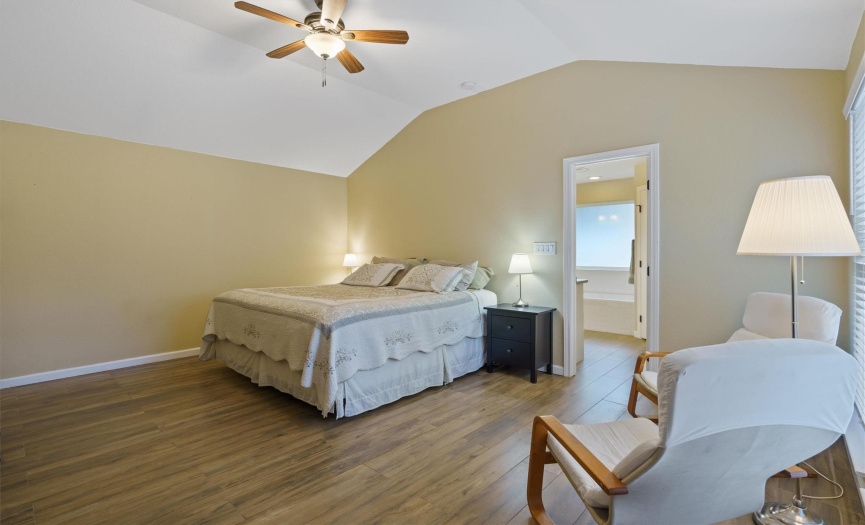 Primary bedroom with large ceilings and ceiling fan for those hot summer nights 