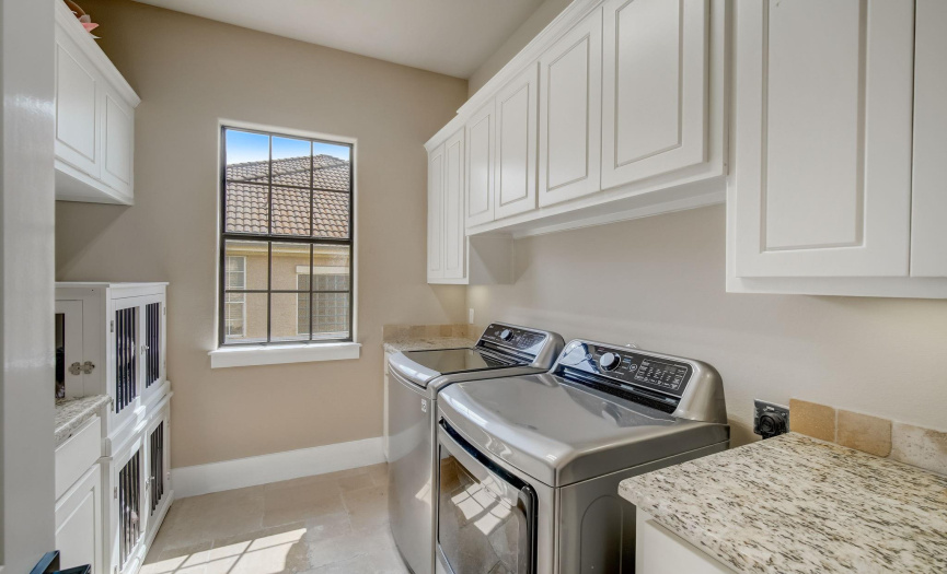 Large laundry room with sink on main level 