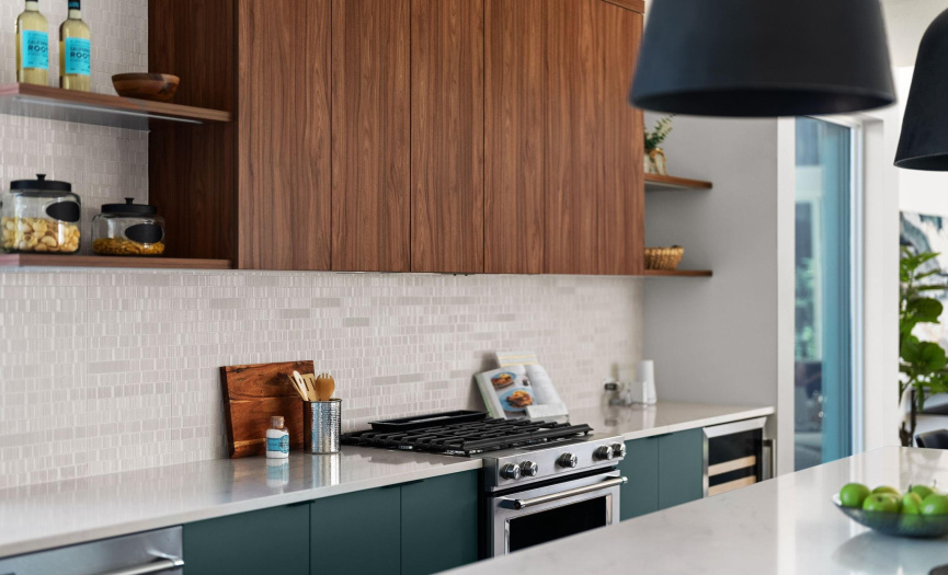 Lavish Cabinets and custom backsplash to compliment the Kitchen-aid appliances