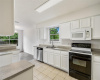 Kitchen - This bright, white, and airy kitchen is open and inviting offering a timeless appeal.