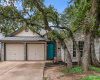 Attractive single level home nestled under the tall oaks