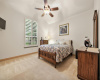 Secondary bedroom with ceiling fan