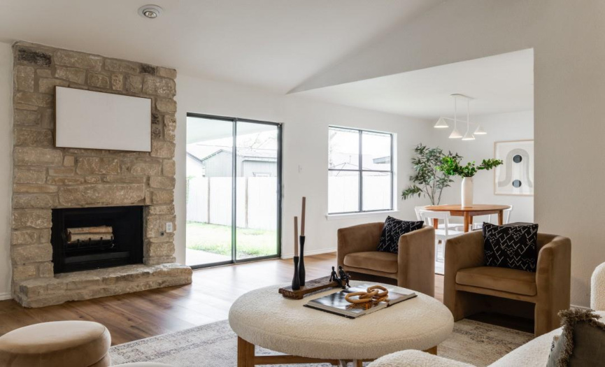 The Gas Started Fireplace with Stone surround makes for a great focal point in this Family Room.