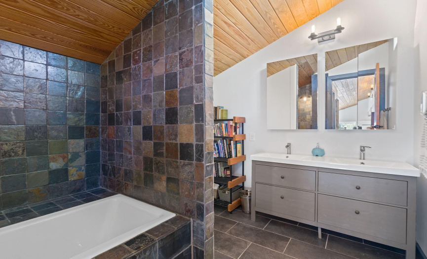 The upstairs restroom with a soaking tub and double vanities