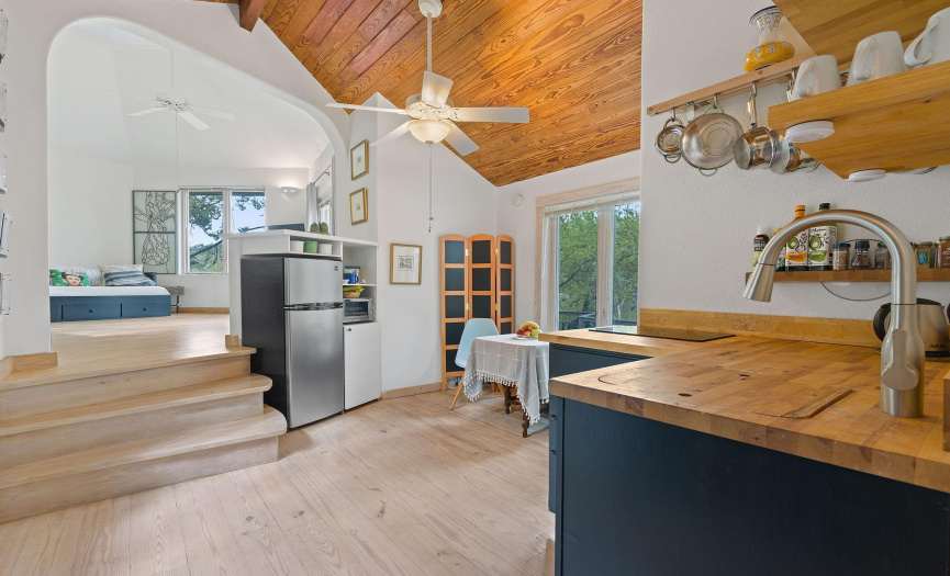 Casita kitchen up to the living area with treehouse views