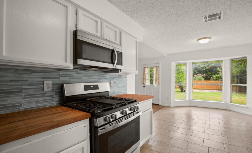 Recent stainless steel appliances and interior paint add to the charm of the cooking area